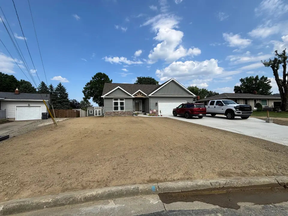 Front yard with exposed soil before hydroseeding application
