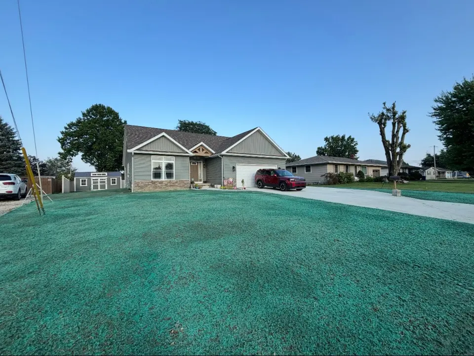 Front yard lawn after hydroseeding with even grass coverage