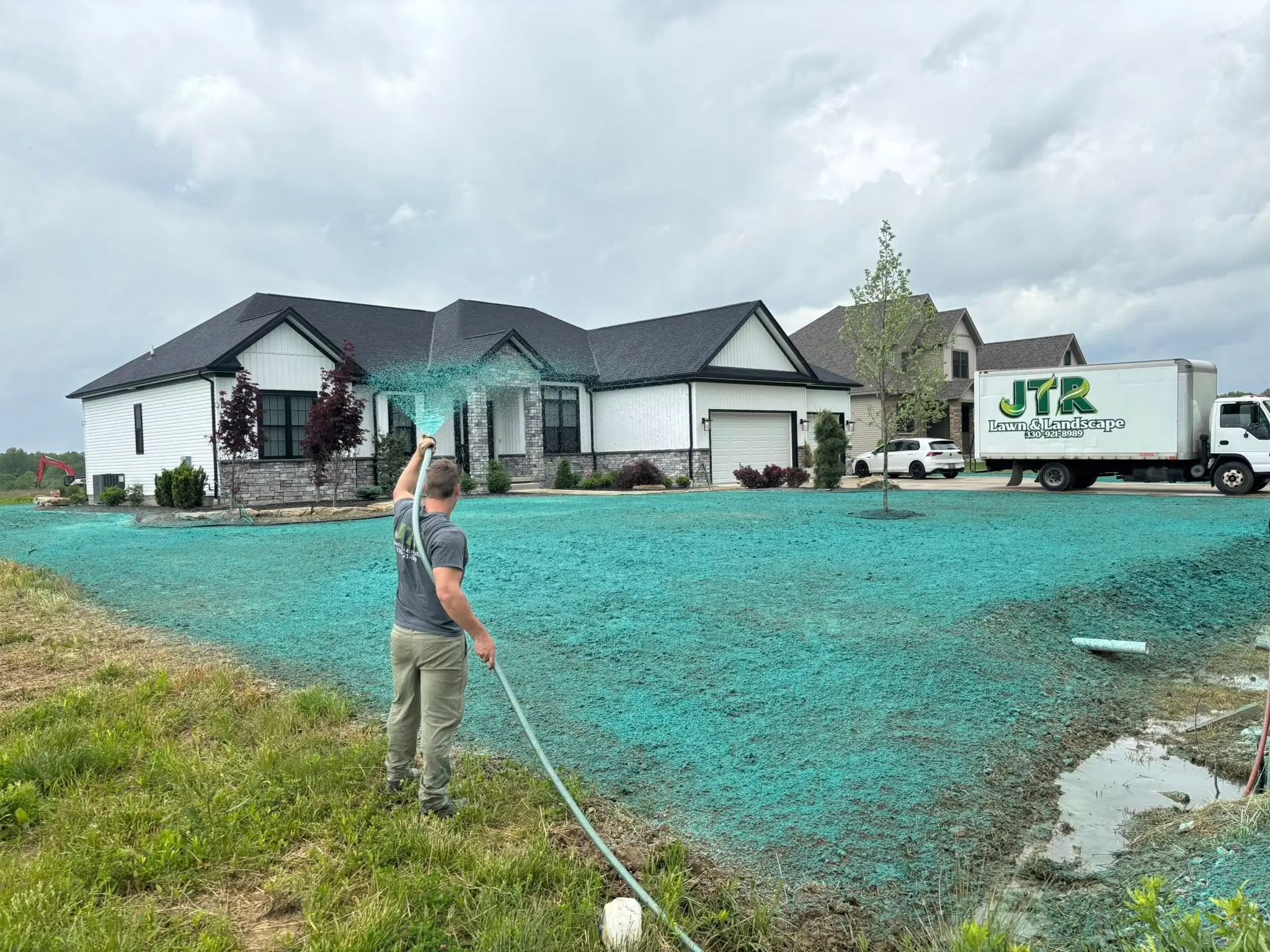 New lawn installation using hydroseeding for fast, uniform grass growth