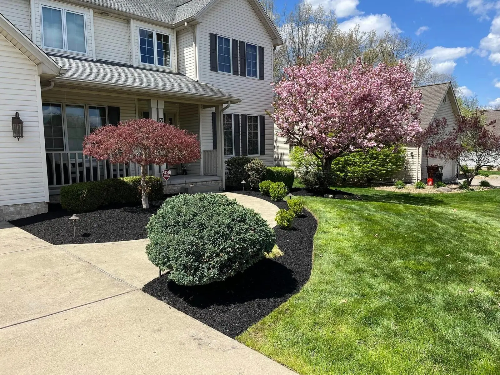 Fresh lawn mowing, mulching, and landscaping at a residential home in Youngstown, Ohio