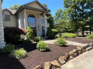 Residential landscaping with mulch beds and stone edging at a well-maintained home in Poland, Ohio